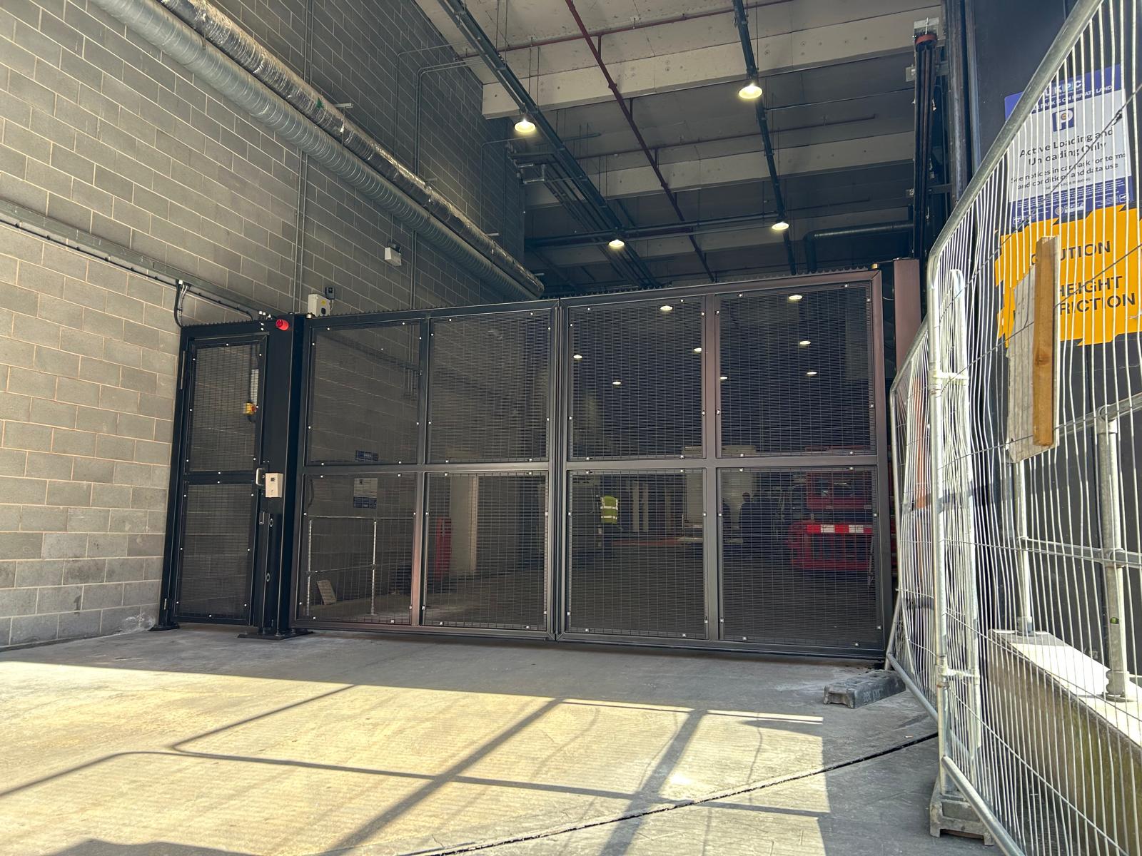 Front View of Automatic Double Swing Gate with Pedestrian Access Leaf Installed by BGS Warrington at SES Engineering Services Facility in Spinningfields, Manchester