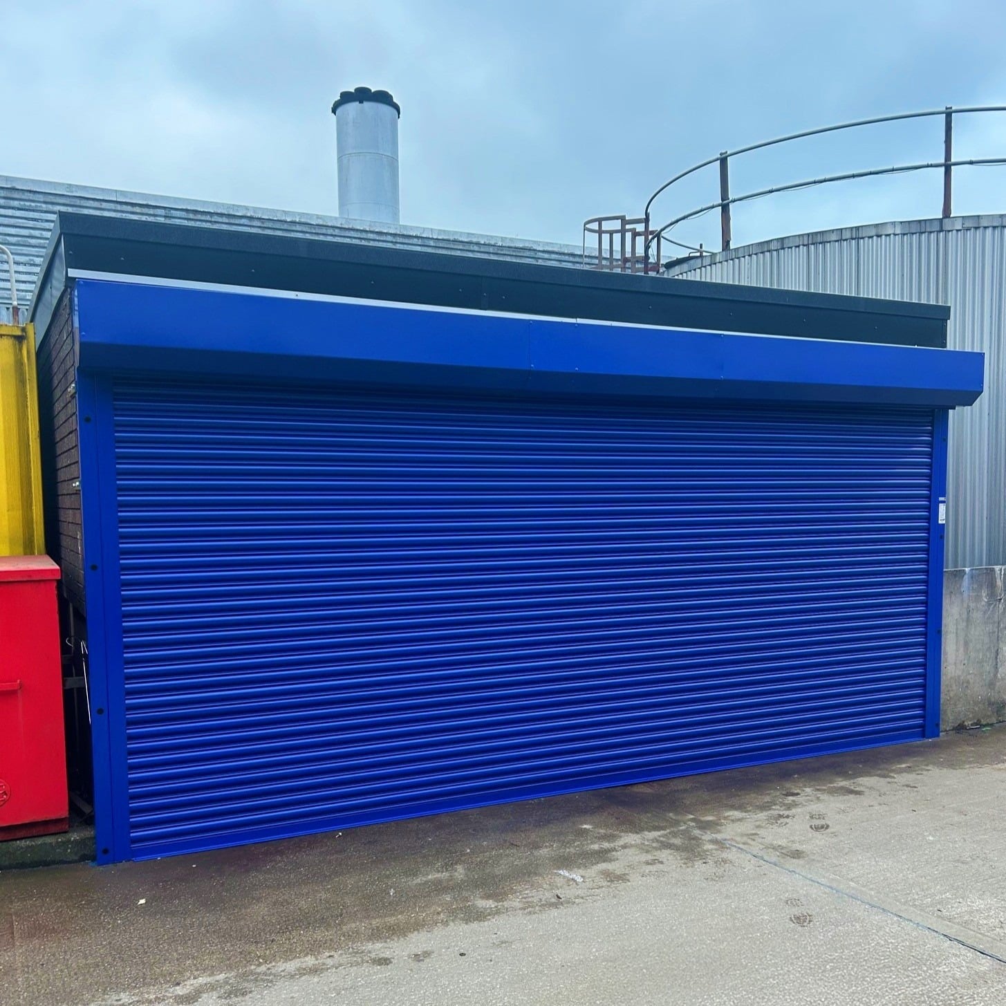 New blue tubular motor roller shutter installed by BGS team at Royal Preston Hospital for client Lancashire Teaching Hospitals
